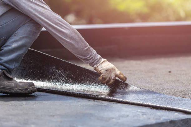 Professional Waterproofing technician working in Roosevelt, NY